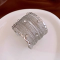 Macro shot of silver multi-layer wire cuff bracelet with sparkling crystal rhinestones - Silver