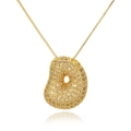 Macro shot of gold-plated bean pendant necklace with white zircon pavé setting - Letter D (D1079-D)