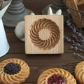 Square beechwood cookie mold with solar flower pattern shown with finished biscuits - Sandwich Rotating Flower A