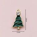 Macro view of green enamel Christmas tree charm with gold trim and crystal stud details - 2393 Green Rhinestone Christmas Tree