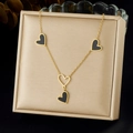 Gold-plated stainless steel necklace with black heart pendants on champagne jewelry box - Gold Black Drip Oil Four Hearts Style (N3932)