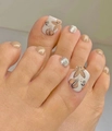 Nude press-on toenails featuring hand-painted white flowers and silver glitter accents - 1640-Nude Hand Painted Flowers