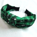 Western style green and black plaid knotted headband with white snowflake patterns - Green Black Snowflake Fabric Plaid