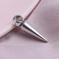 Polished silver stainless steel cone pendant accessory on soft pink satin fabric - Silver