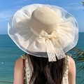 Detail of elegant straw sun hat with large lace bow and organza ruffled brim - Beige Mesh Straw Hat (D-391)