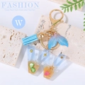 Ocean themed letter W keychain with blue tassel and resin sand beach star details - Letter W