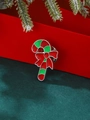 Broche canne de Noël avec nœud rouge sur fond élégant en velours vert foncé - Sucre d'Orge (6069)