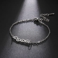 Zilveren roestvrijstalen armband met holle pootafdrukken en een verstelbare schakelketting - Zilver
