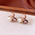 Close-up of 18K gold-plated stud earrings featuring white, pink, and purple pearls - Three-Color Pearl Gold Stud Earrings