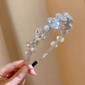 Detail of luxury hairband with heart crystals, rhinestones and elegant pearls - Silver Bowknot