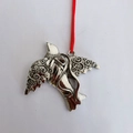 Silver metal dove ornament with scroll texture and red hanging cord for Christmas tree - Flying Bird
