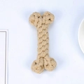 Durable bone-shaped cotton rope dog toy in natural beige for teeth cleaning and play - Earthy Yellow