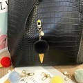Detail of a cute ice cream cone pom-pom keychain with pearl charm on a bag - Single Piece / Black