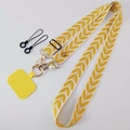 Adjustable crossbody phone strap with yellow leaf pattern, gold buckle, and pearl charm - Yellow