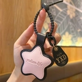 Pink star-shaped leather keychain with black border and spiral wristband strap - Leather-Pink Star