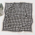 Black and white polka dot square silk scarf with striped border in a flat lay view - 70*70cm / Black Background Polka Dots