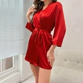 Detail of a dark red satin kimono robe showing smooth fabric texture and V-neckline style - S / Red