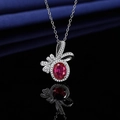 Elegant silver necklace featuring a large red oval gemstone with a crystal bow pendant - Red Diamond Necklace Xl-112