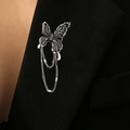 Silver butterfly brooch with black enamel wings and hanging chain on black suit lapel - Butterfly with Black Gem Tassel