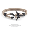 Detail of handcrafted milan cord bracelet with a matte black airplane metal clasp - Khaki Rope Black Airplane