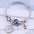 Silver twisted wire bracelet with bee and heart charms and black floral beads - Black