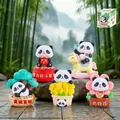 Five-piece panda resin figurines set on natural rocks with lush bamboo forest background - 1081-12 Set of Five Pandas