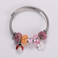 Detail of beaded charm bracelet with pink butterfly, ladybug and flower pendants - Pink Butterfly & Ladybug Style