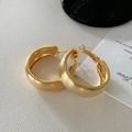 Detailed view of thick matte gold hoop earrings on a textured minimalist background - 46# 925 Sterling Silver Earring Post - Chunky Hoop Matte Earring Style