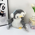 Cute gray and white plush penguin backpack with blue earmuffs and adjustable straps - Grey Penguin
