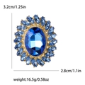 Luxury oval blue crystal brooch with sunflower rhinestone border and size measurements - Blue