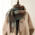Plaid tassel scarf in brown and green check pattern on mannequin with beige coat - Green & Coffee Plaid