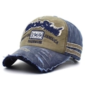 Vintage washed baseball cap featuring 1969 embroidery and distressed patchwork design - Army Green with Navy Brim