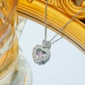Collana a cuore in acciaio al titanio con pietra rosa danzante e zirconi bianchi - Collana Cuore Scintillante / Argento