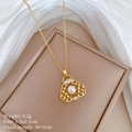 Close-up of gold hollow bag pendant with pearl and rhinestones on a jewelry box - Gold Handbag Style (A229)