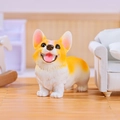 Miniature resin Corgi dog ornament in yellow and white standing on wooden floor - A182-05 Corgi