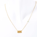 Collar de acero inoxidable dorado con número de ángel 444 y una pequeña gema verde - 444
