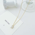 Minimalist gold necklace featuring a rectangular clear zircon pendant on a thin chain - 14K Gold + White Zirconia