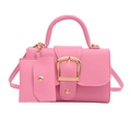 Pink PU leather crossbody bag with top handle and gold buckle on a white background - Pink