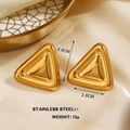 Golden stainless steel triangle stud earrings measuring 2.8cm on beige silk fabric - Gold Triangle Style (1751)