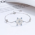 Sterling silver snowflake bracelet with blue gemstone in a minimalist icy style - 925 Silver / Silver