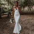 Elegant white satin wedding dress with a deep V-neckline and slim-fit fishtail silhouette - US Size 2 (S) / Ivory