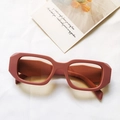 Retro square frame sunglasses in matte brick red with amber lenses on white fabric - Pink