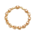 Detailed macro view of pear-cut champagne zircon stones set in a gold chain bracelet - 24K Gold Plated Champagne