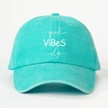 Detail view of mint green cotton baseball cap with white good ViBeS only embroidery - One Size / Lake Blue