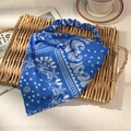 Elastic blue paisley bandana headband with white floral patterns for hair styling - Blue