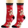 Close-up of Christmas crew socks with gingerbread man and snowflake patterns on red knit - One Size / Gingerbread Man
