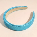 Close-up of sparkling blue sequined wide headband with soft beige inner lining - Blue