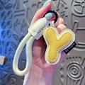 Creative letter Y leather keychain with yellow and cream tones and braided wrist strap - Letter Y
