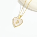 Golden heart necklace with white mother of pearl and Virgin Mary relief detail - White Shell Virgin Mary Heart
