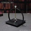 Modern black metal napkin holder with crystal handle and weighted center bar for tables - Arched Style / Black